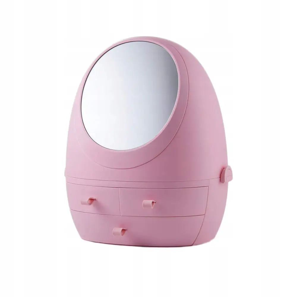Organizer for kosmetikk i rosa plast med speil, tre små skuffer og avrundet design, sett skrått forfra.