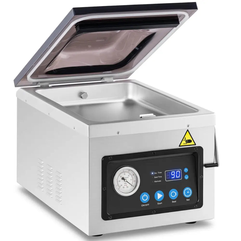 Pakker vakuum kammermatforseglingsmaskin, skråvisning med åpent lokk, digitalt display og synlig varseltrekant.