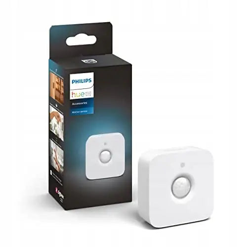 Philips Hue bevegelsessensor, hvit enhet med avrundede kanter og original emballasje synlig i bakgrunnen.