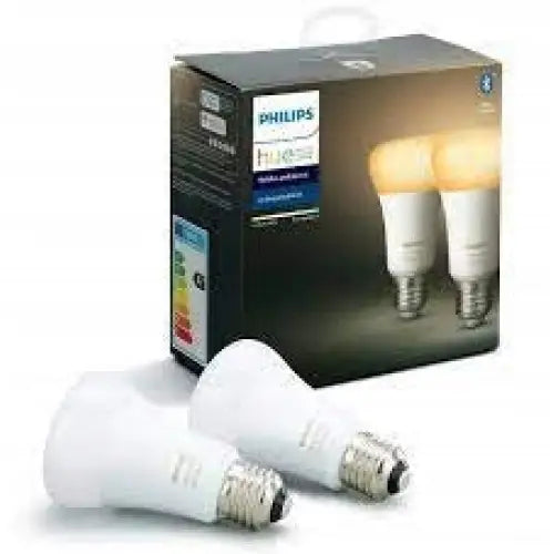 Philips Hue White Ambiance smartpærer E27, to hvite LED-pærer foran mørk eske med varm lysillustrasjon.