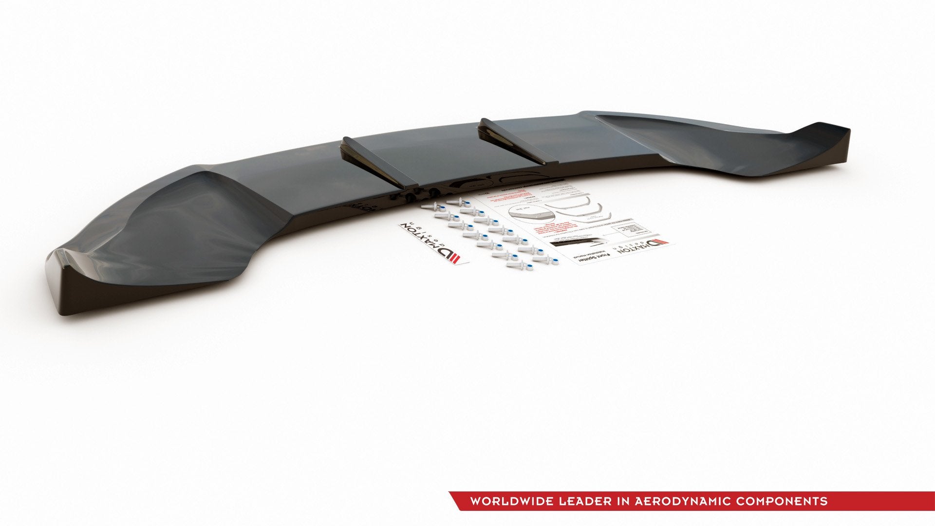 Frontspoiler Mini Countryman MK1 Jcw i sort plast med monteringsutstyr og instruksjonsark på hvit bakgrunn.