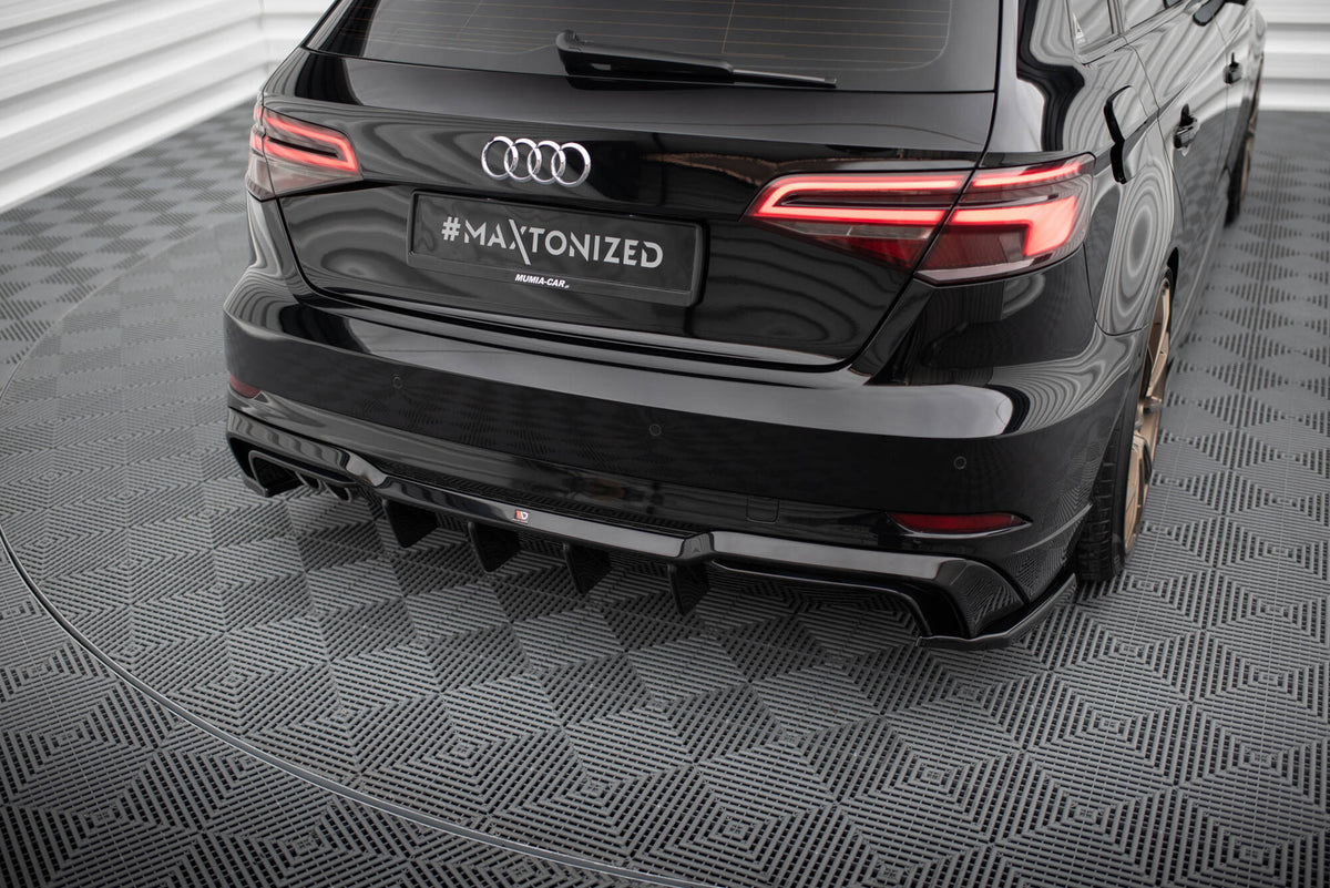 Bakre diffuser til Audi A3 S-Line Sportback i nærbilde av eksosutskjæring