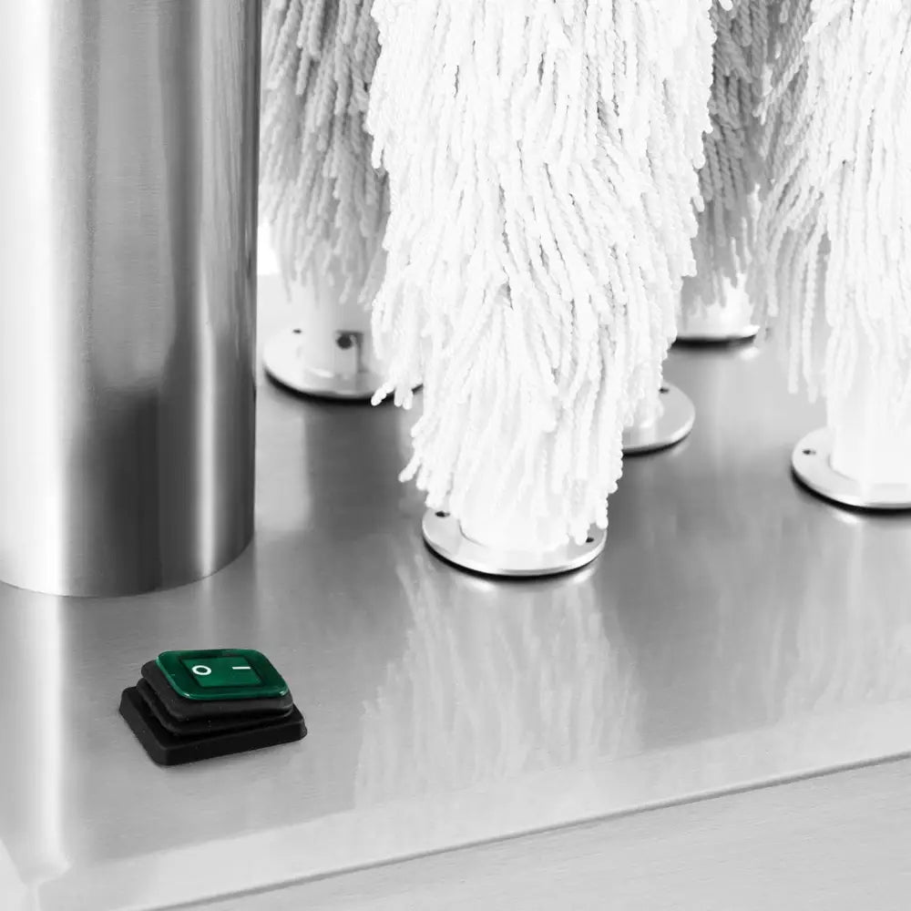 Poleringsmaskin for glass, detaljert nærbilde av fem hvite mopp-hoder og grønn av/på-bryter på metallbase.