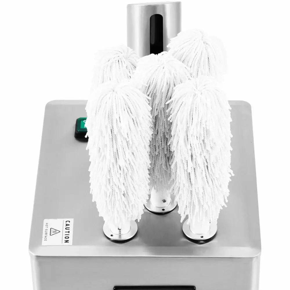 Poleringsmaskin for glass, skråvisning med fire hvite børstehoder, grønn startknapp og varselskilt synlig.