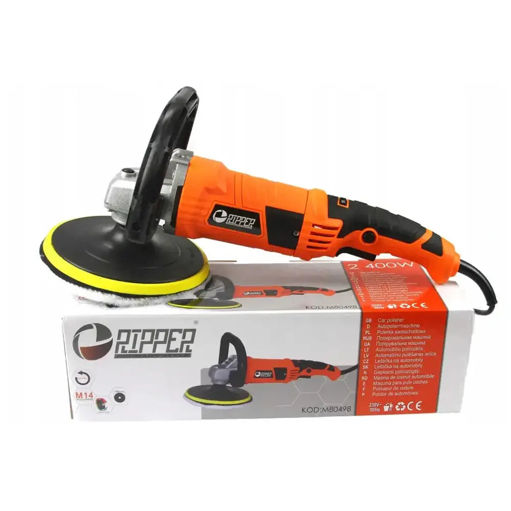 Poleringsmaskin i oransje og svart, sidevisning oppå esken med synlig logo og produktdetaljer.