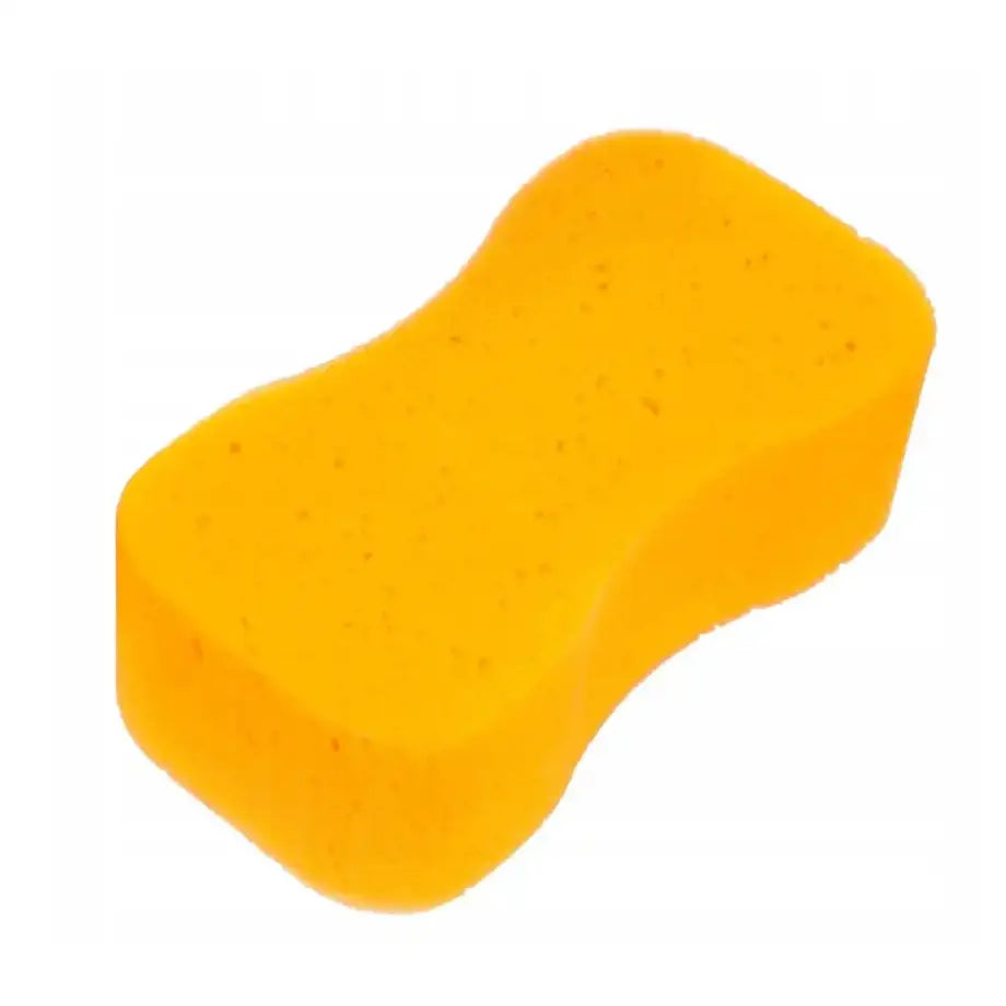 Gul skumgummisvamp med ergonomisk form og innsvingte sider, sett fra skrå toppvinkel.