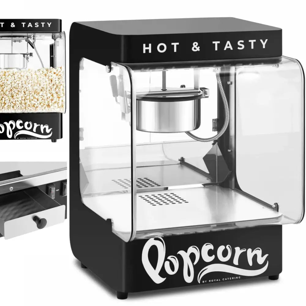 Sort popcornmaskin med glassvegger, synlig stålkjele og teksten "HOT & TASTY" på toppen.