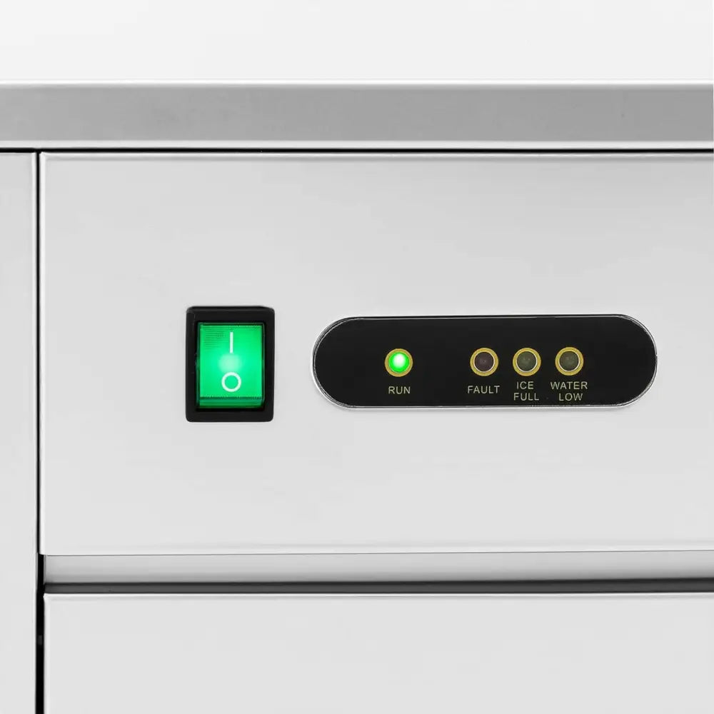 Kontrollpanel på iskvern og isflakemaskin med grønn av/på-bryter og fire statusindikatorer.