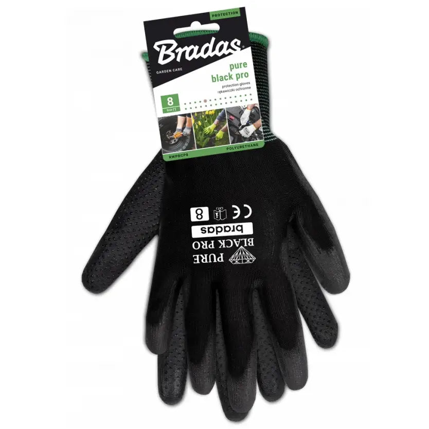 Sorte syntetiske hansker med hvit tekst og grønn kant, sett ovenfra med pappetikett festet øverst.