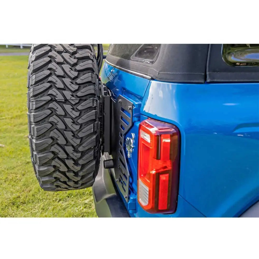 Repositioning av Reservehjulholder med Klaffforsterkning - Ford New Bronco 4 d 21-