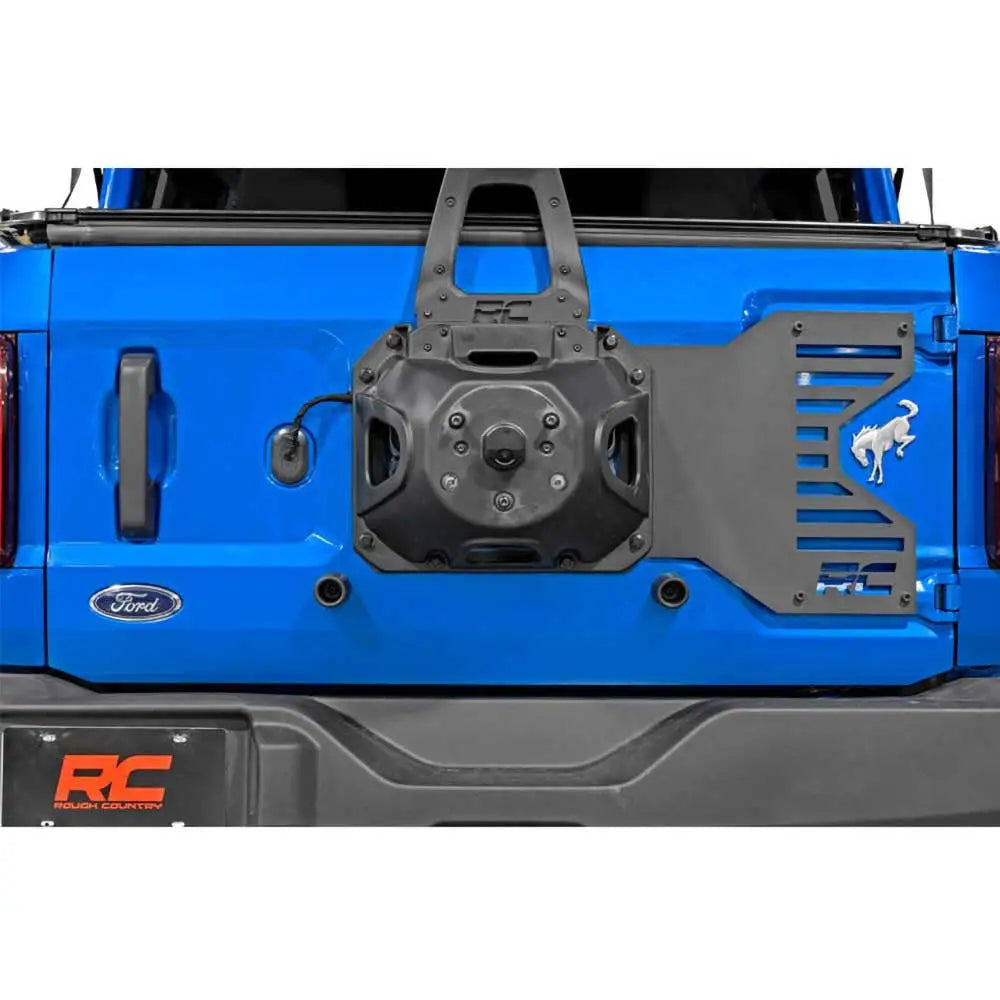 Repositioning av Reservehjulholder med Klaffforsterkning - Ford New Bronco 4 d 21-