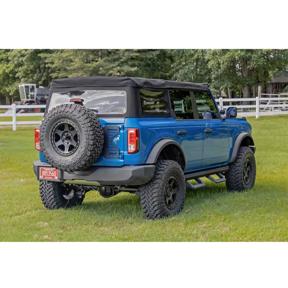 Repositioning av Reservehjulholder med Klaffforsterkning - Ford New Bronco 4 d 21-