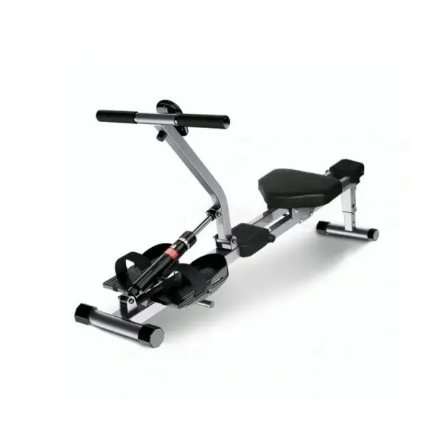 Romaskin for hjemmetrening, skrå sidevisning med fokus på fotstropper og komfortabelt, polstret sete.