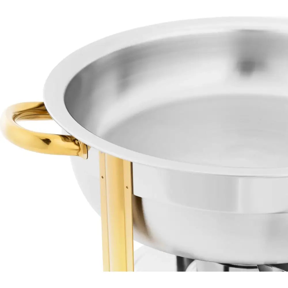 Rundt bord varmeapparat med lokk, nærbilde av gullfargede håndtak og støtteben mot hvit bakgrunn.