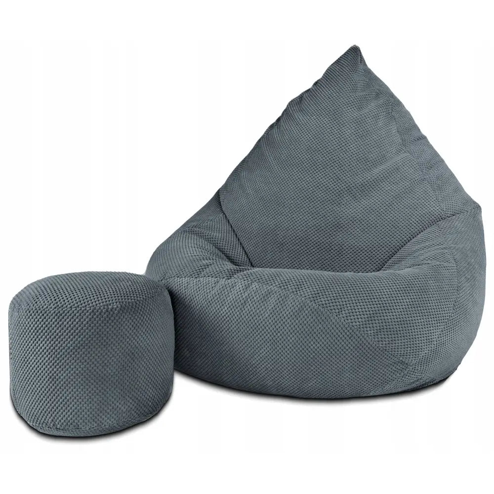 Sakkosekk Puff XXXXL i grått plysjstoff med strukturert trekk og rund puff, skrå vinkel mot hvit bakgrunn.