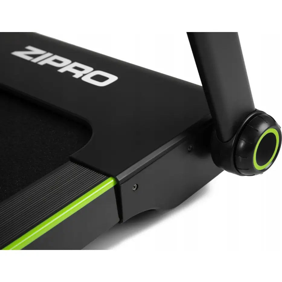 Sammenleggbar Tredemølle Zipro Jogger, skrått detaljbilde av hjul med grønn sirkel og synlig ZIPRO-logo.