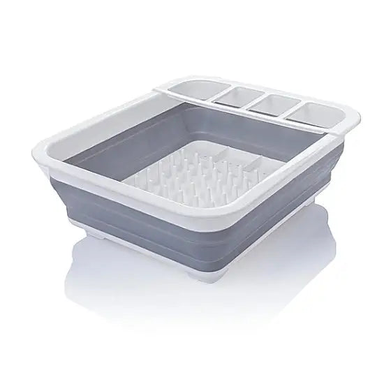 Sammenleggbar silikon tørkestativ, grå og hvit oppvaskkurv med inndelte rom og pigger for bestikk og servise.