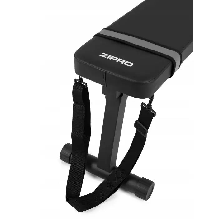 Sammenleggbar treningsbenk fra Zipro, skrå oversiktsvinkel med polstring, justerbare stropper og synlig logo.