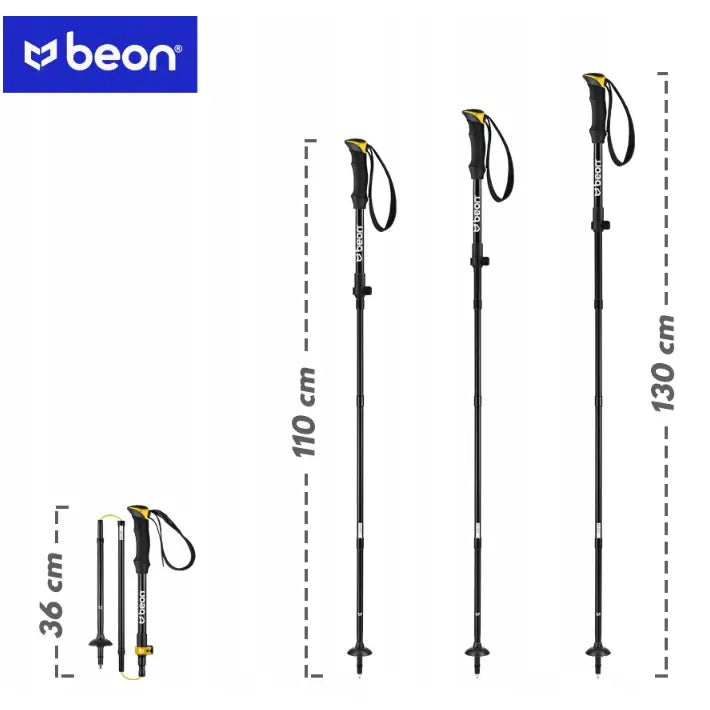 Sammenleggbare, svarte aluminiumstaver med gulldetaljer, vist sammenfoldet og i tre ulike lengder mot hvit bakgrunn.