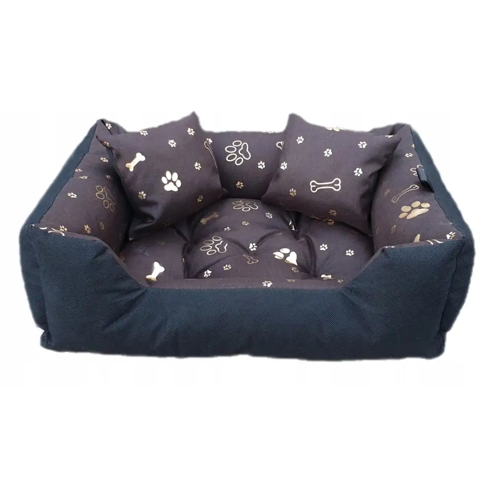 Sengeplass Liggeunderlag for hund, mørkeblå rektangulær seng med myk pute og dekorative beige puter med pote- og beinmotiv.