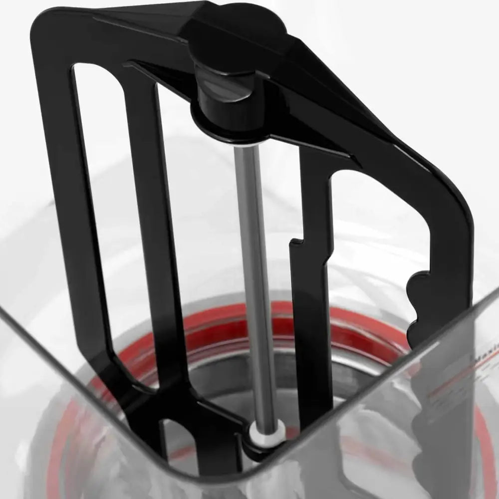 Serveringsautomat for juice, toppbilde som viser sort røreblad i gjennomsiktig beholder med rød silikonring.