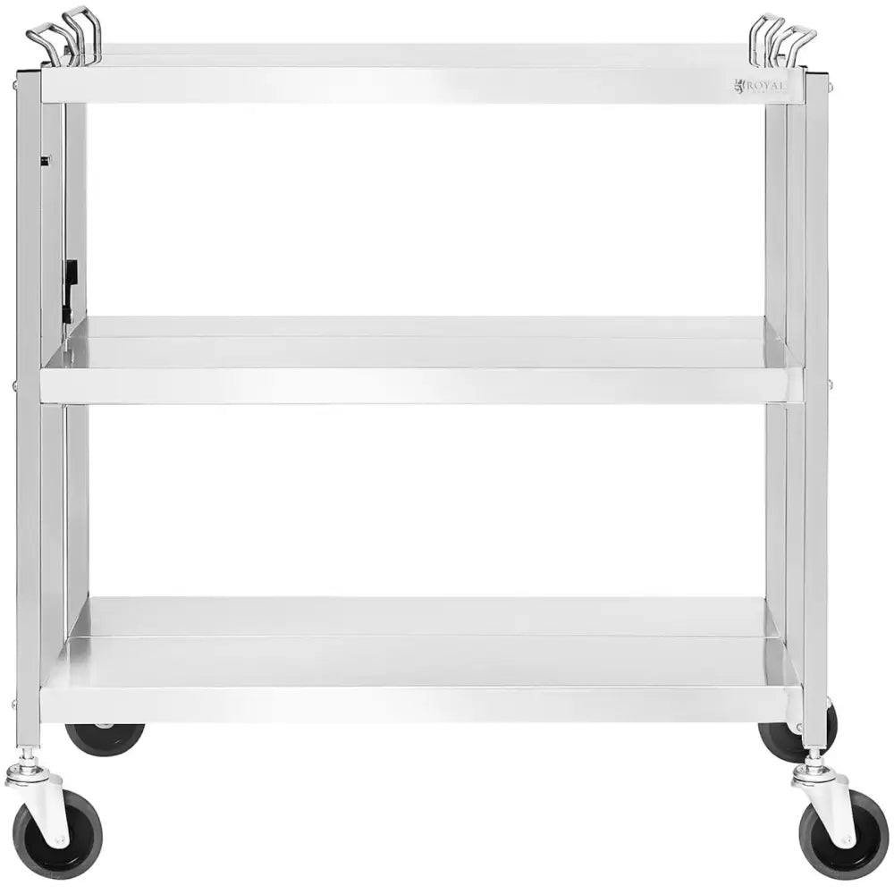 Sammenleggbar serveringsvogn i rustfritt stål med tre hyller, fire hjul og håndtak, sett rett forfra.