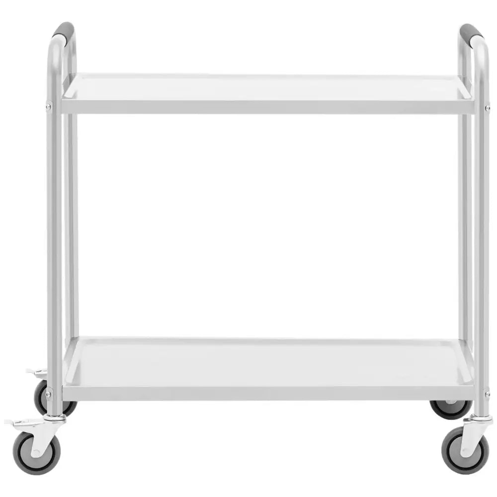 Serveringsvogn i rustfritt stål med to hvite hyller, sett forfra, fire hjul og avrundede håndtak.
