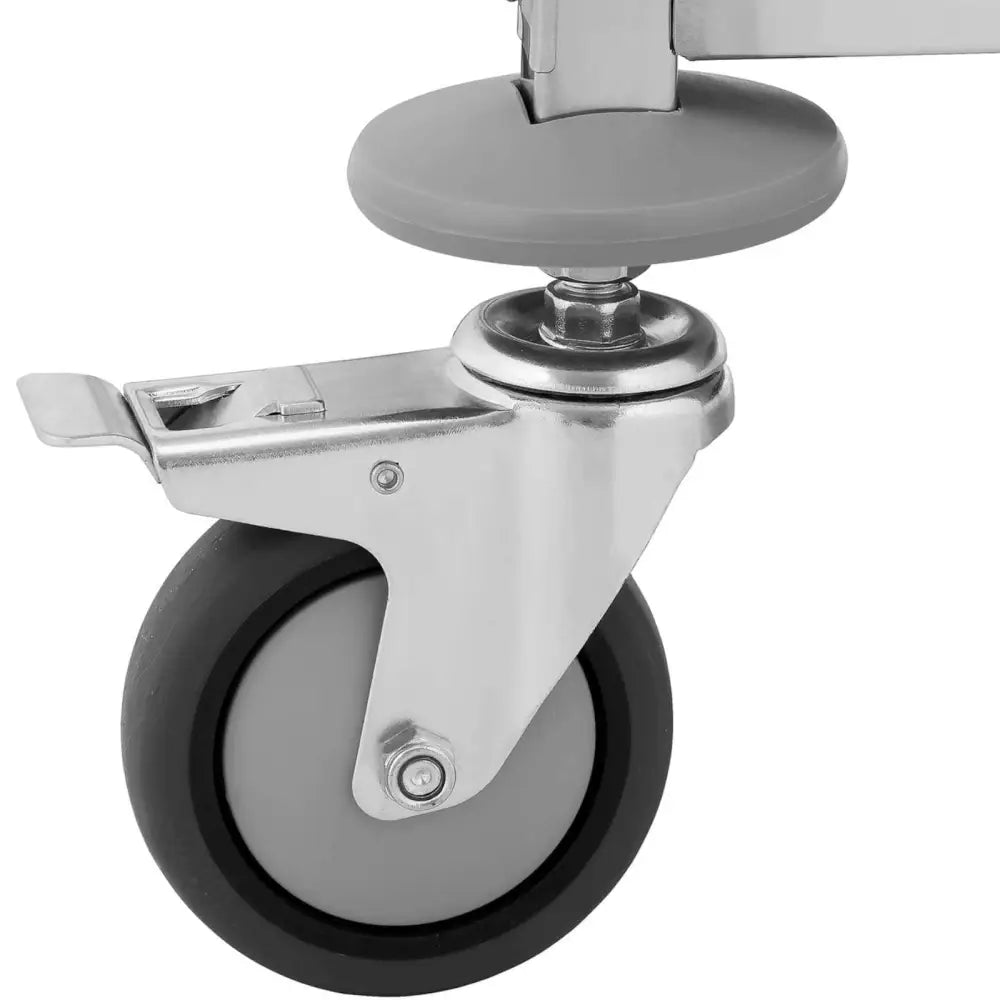 Serveringsvogn hjul med brems, detaljert sidebilde av solid hjuloppheng i metallramme.