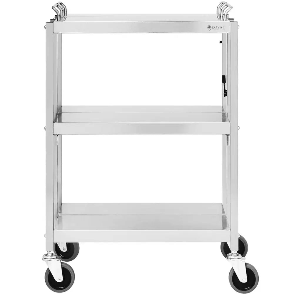 Serveringsvogn i rustfritt stål, tre hyller, fire sorte hjul og toppmonterte håndtak, frontvisning.