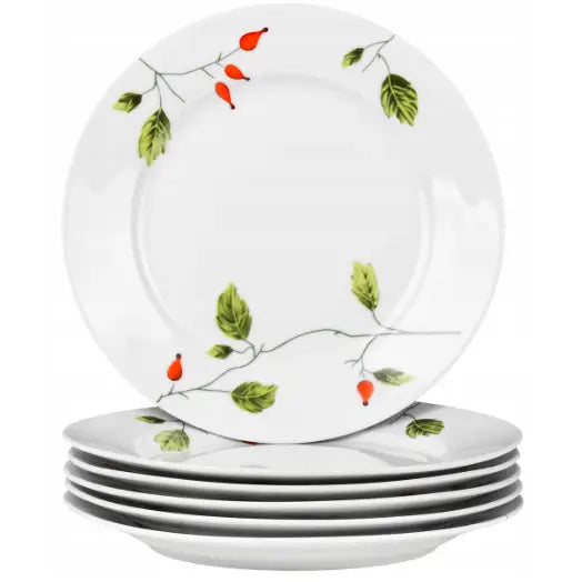 Porselenstallerkener med grønne blad- og nypedekor, seks stykker stablet, én tallerken står bak for visning.