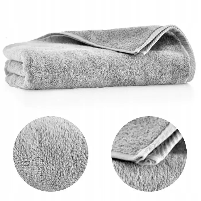 Grå mikrofiberklut sammenbrettet, med nærbilder som fremhever stoffets tekstur og sydd kant.