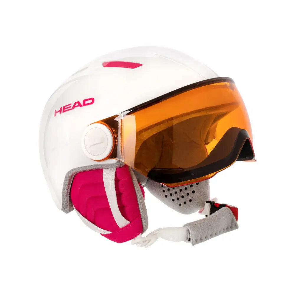 Skihjelm med visir fra Head, hvit med oransje visir og rosa detaljer, sett fra siden med justeringshjul.