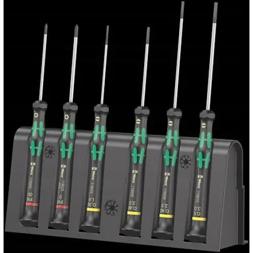 Skrutrekkersett Kraftform Micro, seks presisjonsskrutrekkere med grønne detaljer i sort holder, stående på rekke.