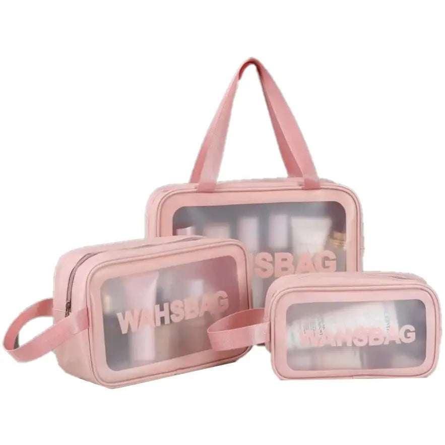 Sminkepung sett med tre rosa, gjennomsiktige toalettmapper i plast, alle med glidelås og teksten WAHSBAG på forsiden.