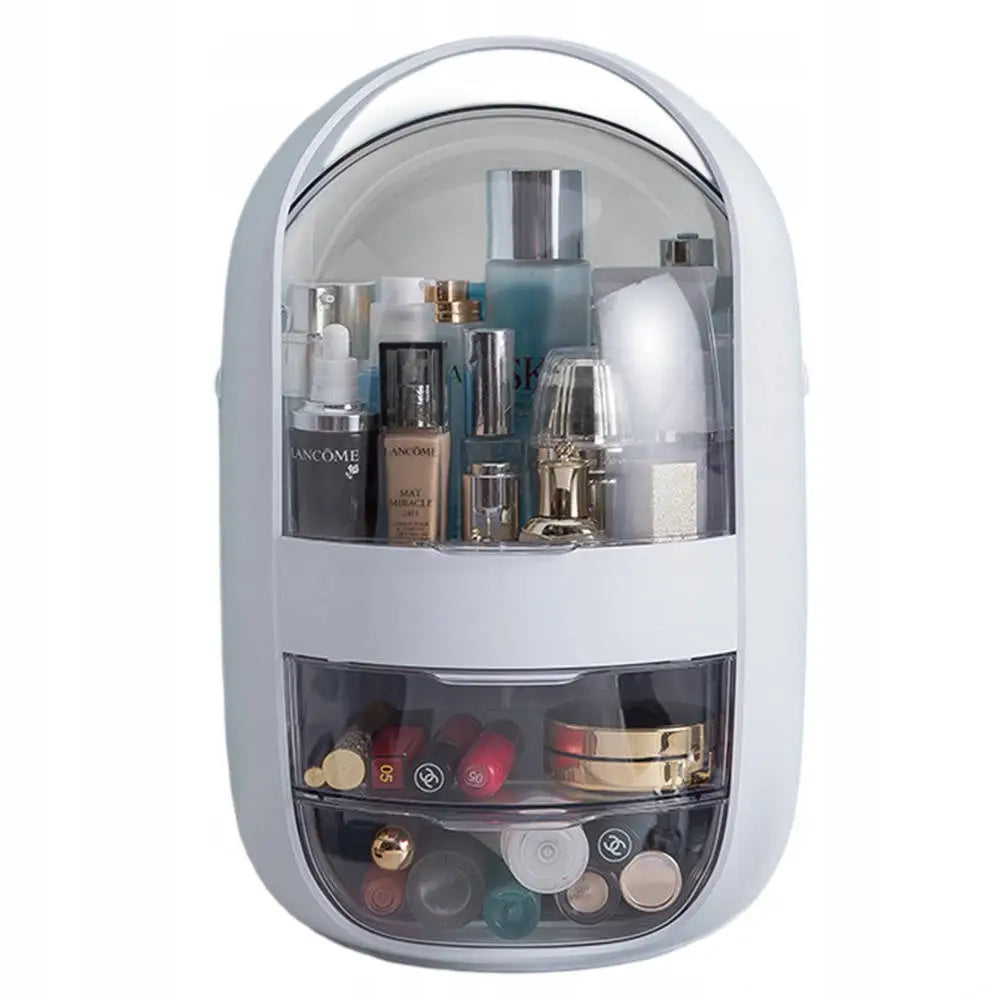 Smykkeskrin organizer i hvitt, oval form med gjennomsiktig lokk og sorterte sminkeprodukter i flere rom.