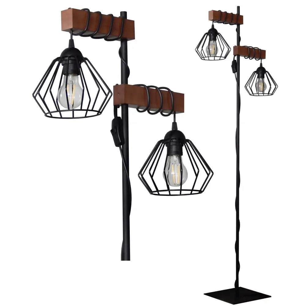 Stående gulvlampe i svart metall og tre, to gitter-skjermede lamper, ledninger rundt lyse treklosser.