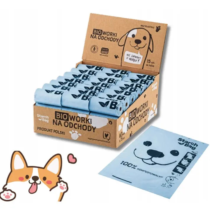Starchbag avfallsposer for hund, lyseblå ruller i åpen eske med sort dyremotiv og én pose med hundeansikt-design synlig.