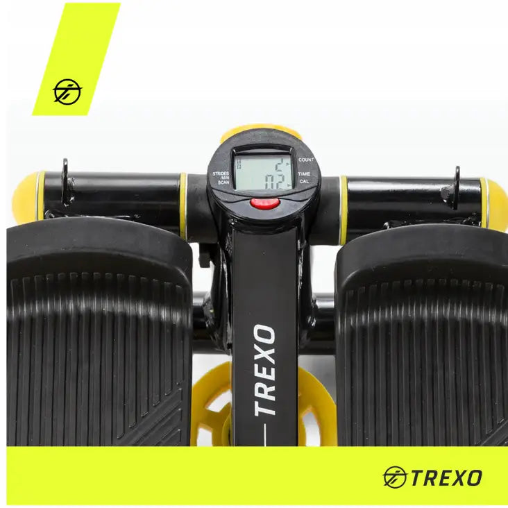 Stepper for aerobic, toppvinkel som fremhever LCD-display, gulldetaljer og rillede, brede fotplater med logo.