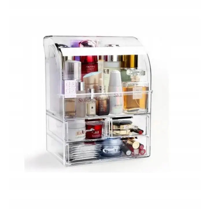 Stor låsbar smykkeskrin og kosmetikkorganizer, gjennomsiktig med flere rom og skuffer fylt med produkter.