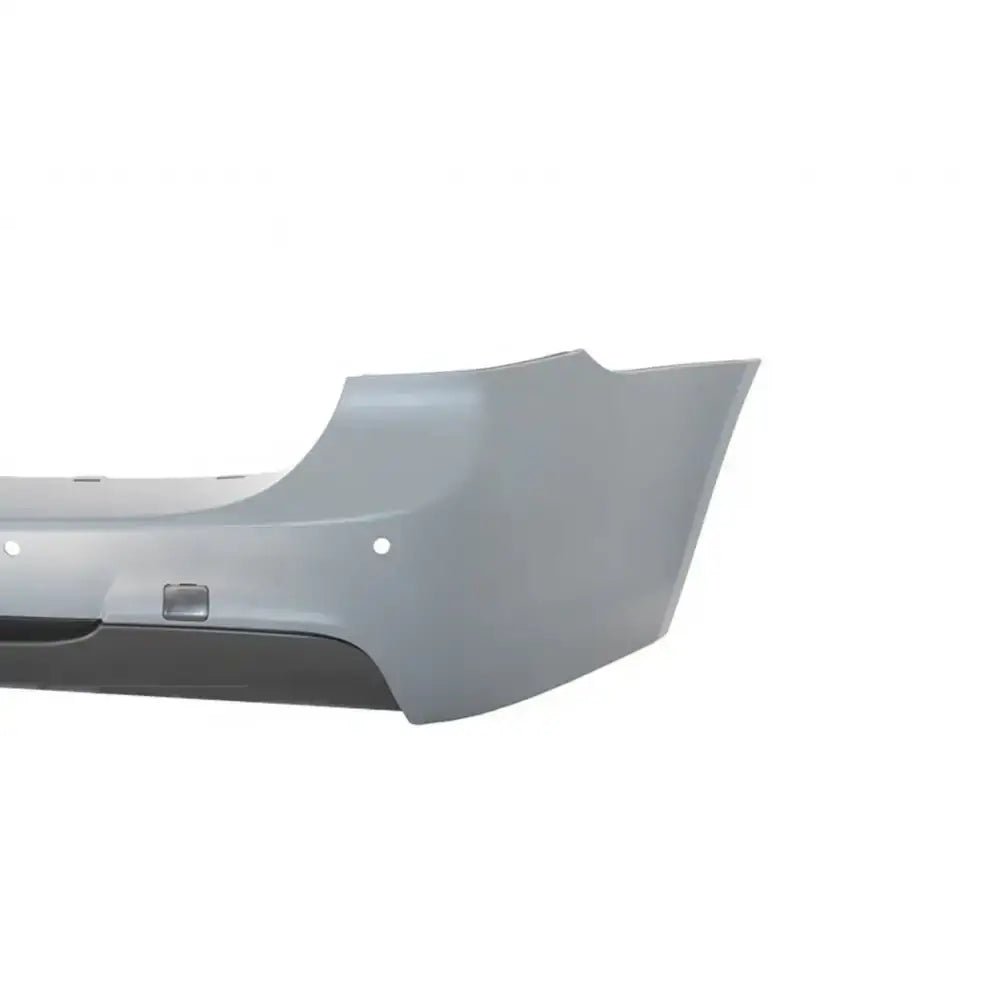Bakre støtfanger til BMW 3 Serie E91 05-08, grå plast, sidebilde med synlige monteringshull.