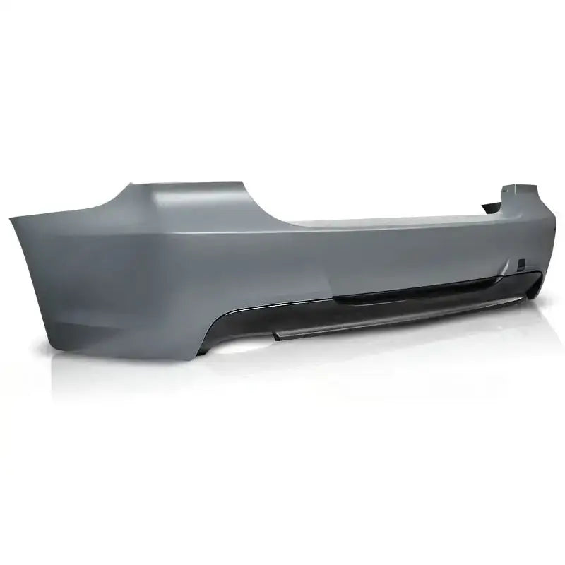 Bakfanger til BMW E90 09-11 M-Pack i grå plast med sort nedre del, sett skrått bakfra.