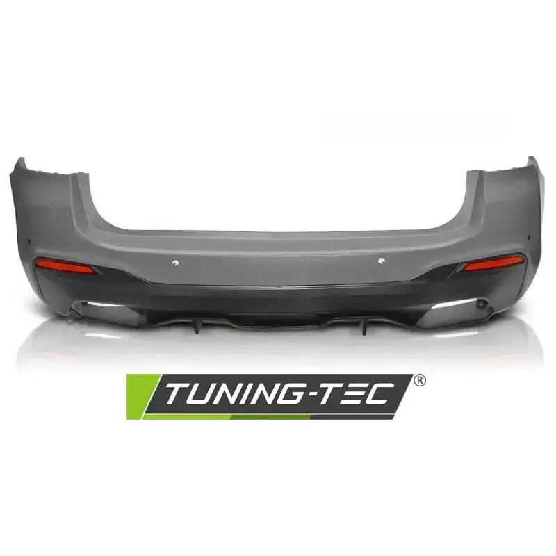 Bakre bumper BMW G31 17- M-Performance Style PDC sett bakfra med refleksdetaljer og svarte markeringer.