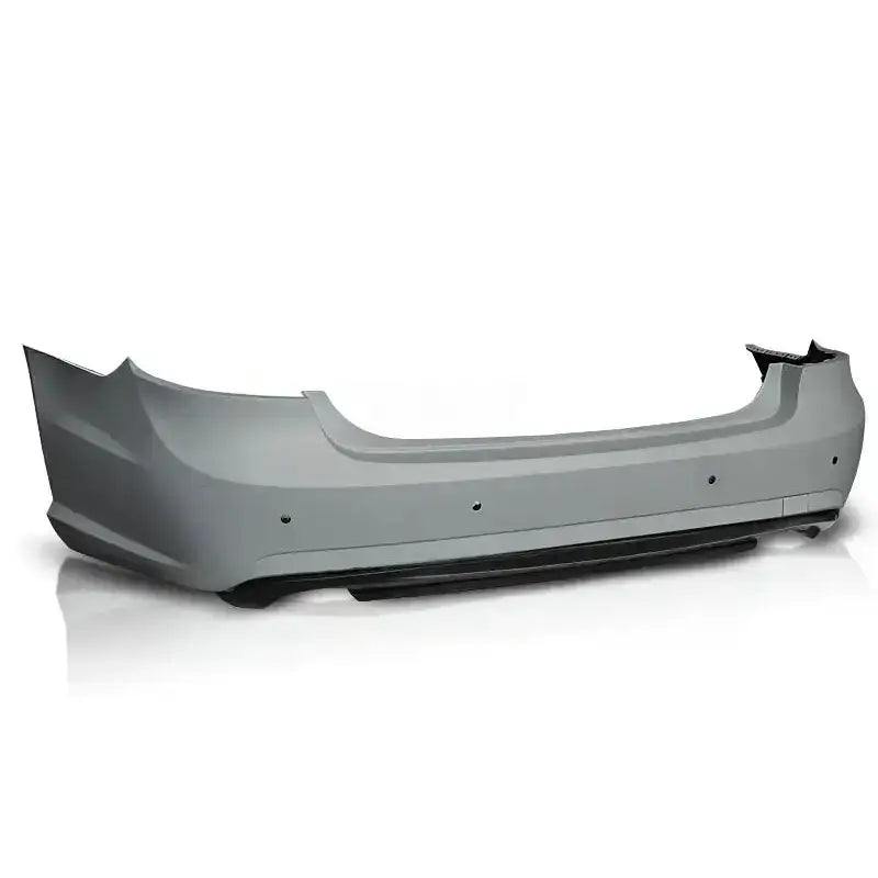 Støtfanger bak til Mercedes W212 09-13 Sedan AMG PDC 2W i lys grå plast med sensorhull.