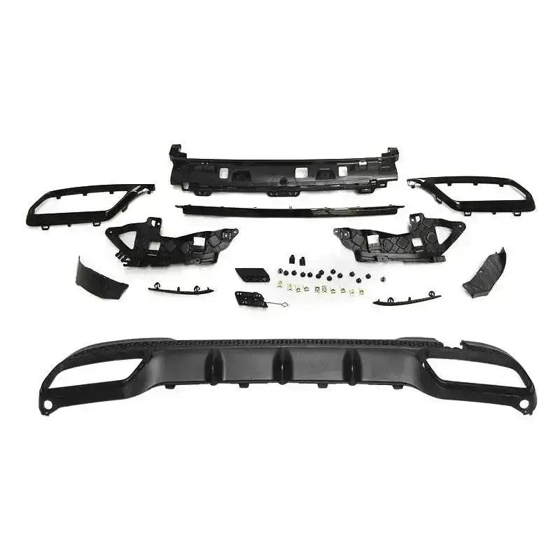Bakre bumper monteringssett til Mercedes W212 E63 AMG Style med svarte plastdeler og metallkomponenter.