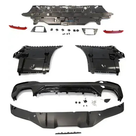 Bakre støtfanger Performance Style PDC til BMW G30 LCI, sorte plastdeler og røde refleks på hvit bakgrunn.