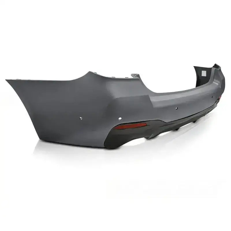 Støtfanger bak Sport Style PDC til BMW G30 LCI, mørkegrå med reflektorer, sett skrått bakfra.