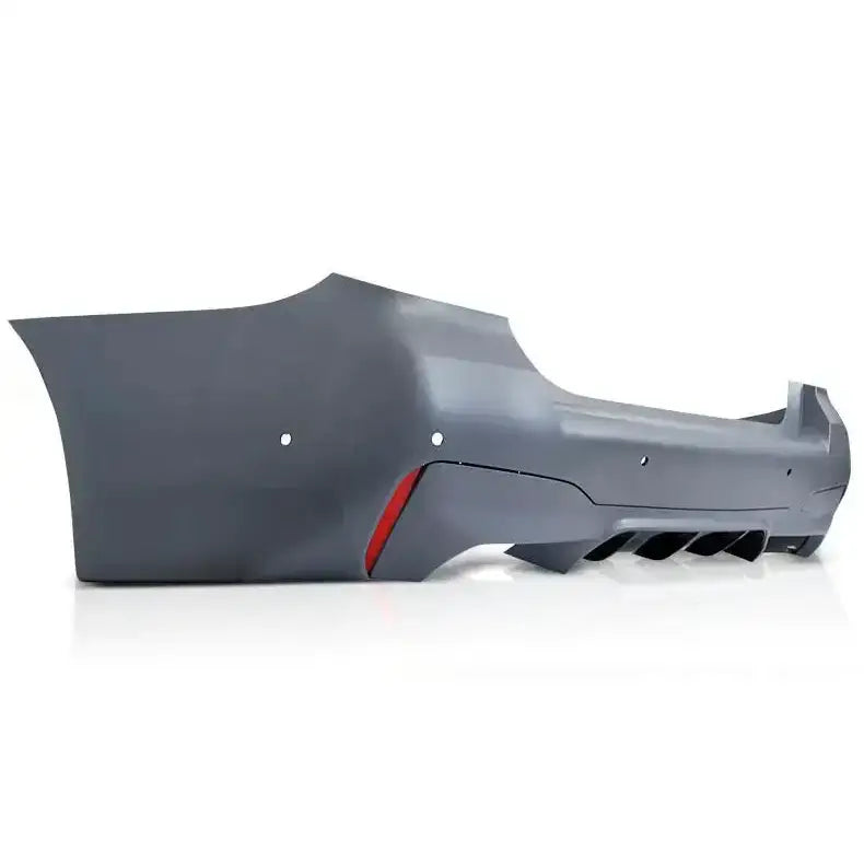 Støtfanger bak Sport Style PDC til BMW G30 LCI i mørk grå plast med rød refleks og luftkanaler.