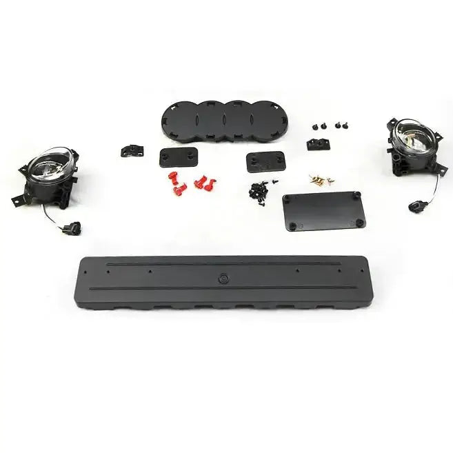 Frontbumper Audi A3 RS Style Black med lykter, plastdeler, koblinger og skruer på hvit bakgrunn.