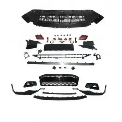 Front bumper Audi A5 18- Sport Black PDC komplett sett sett ovenfra med flere plastdeler på hvit bakgrunn.