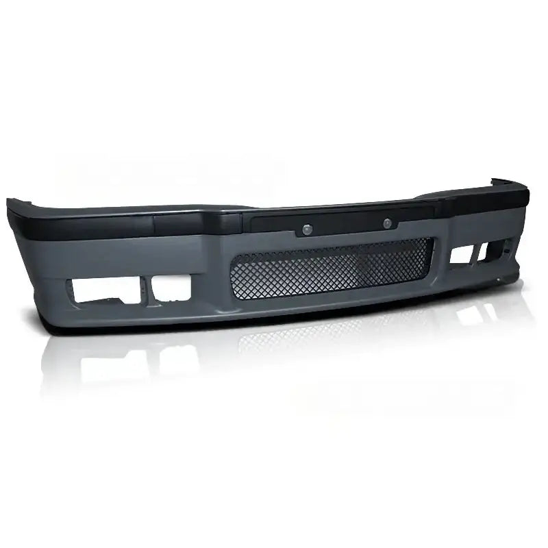 Frontfanger til BMW E36 M-Pack, grå plast med svart gitter og luftåpninger, sett forfra.